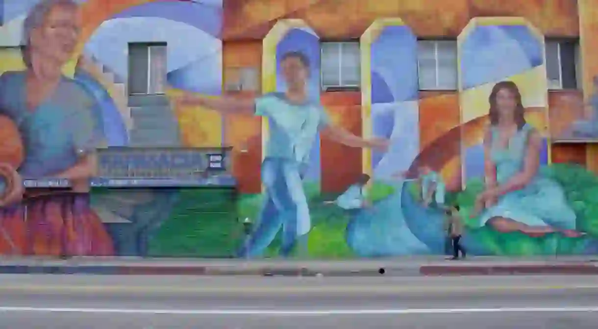 Mickey and Gus pass a mural on Echo Park Avenue off Sunset Boulevard