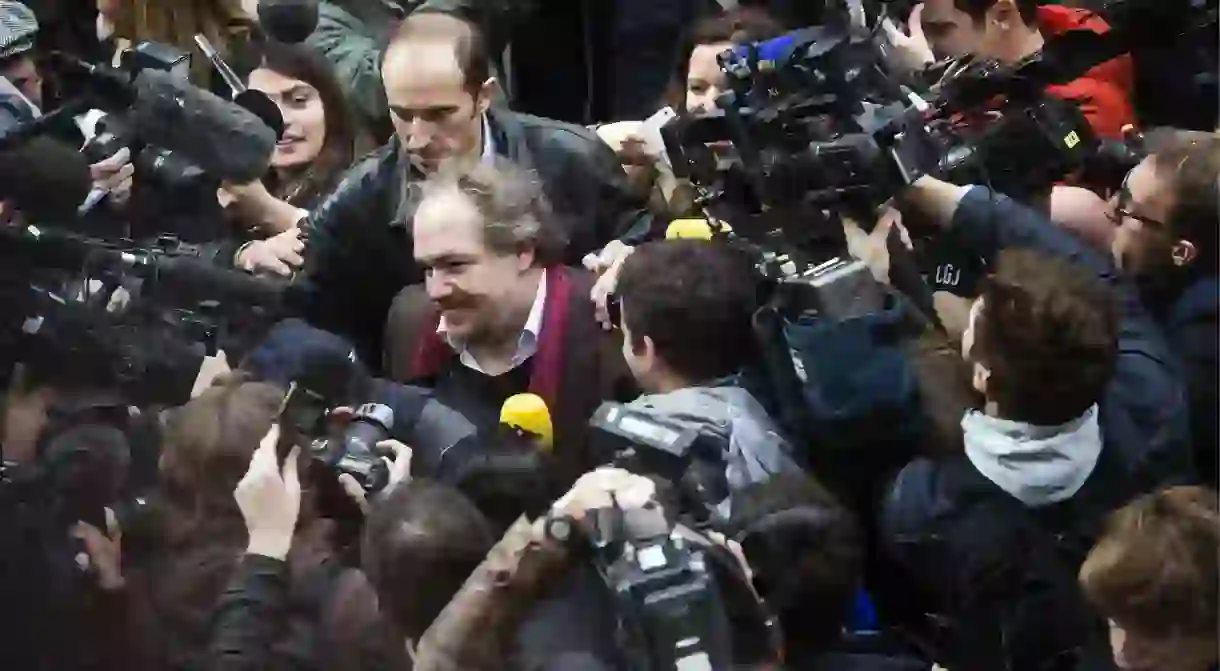 A swarm of people surround Énard after he was announced winner of the Prix Goncourt (2015)