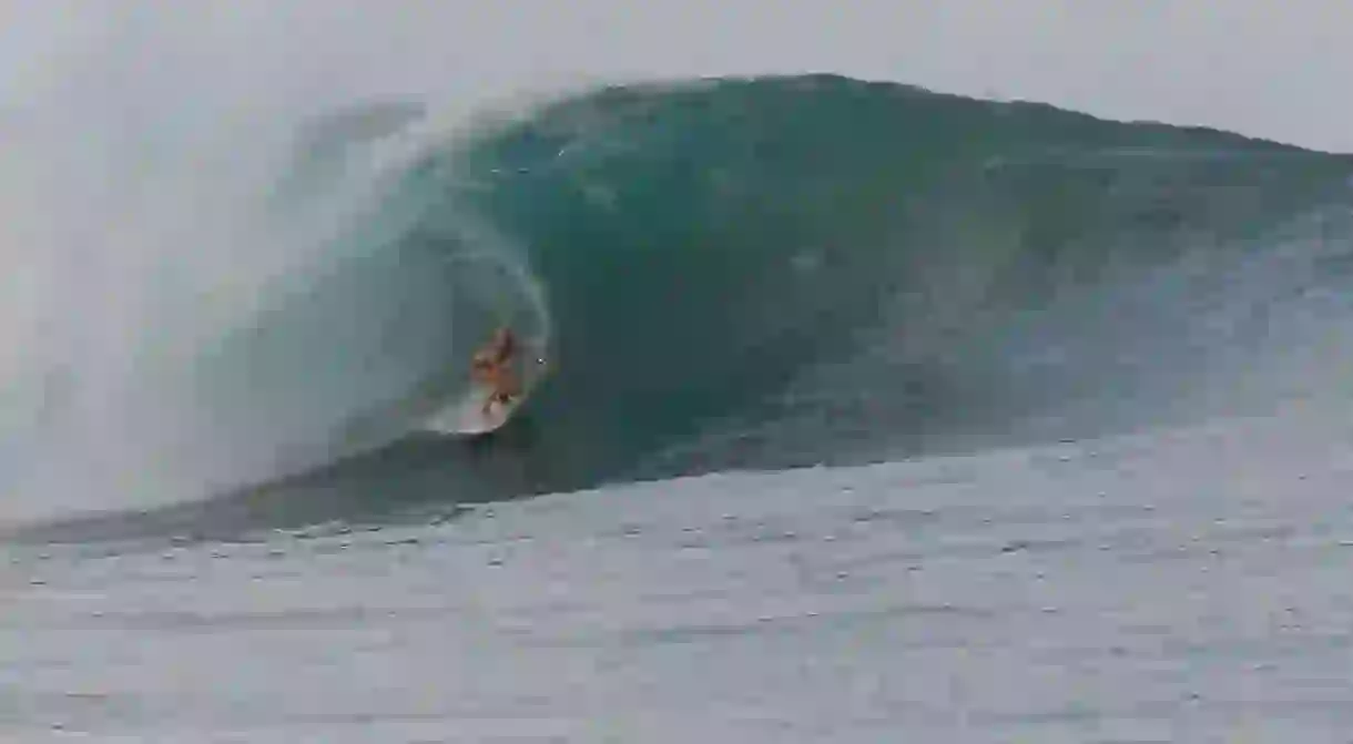 Riding a CheBoards surfboard on this beast of a wave