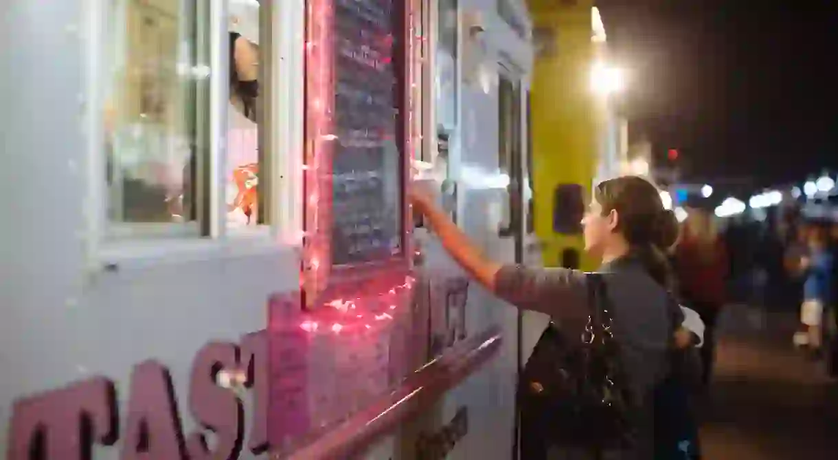 Woman ordering at a food truck