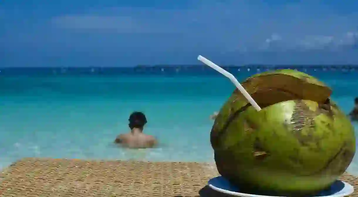 Drinking from a coconut