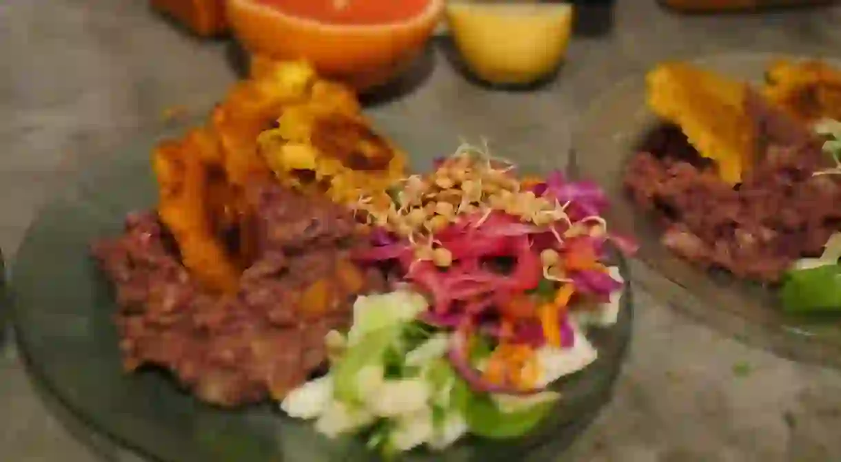 Refried beans, plantains and salad from the Latin menu at Jueves A La Mesa