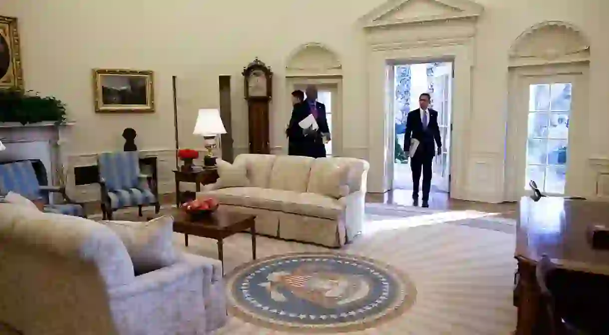 Obama enters the Oval Office