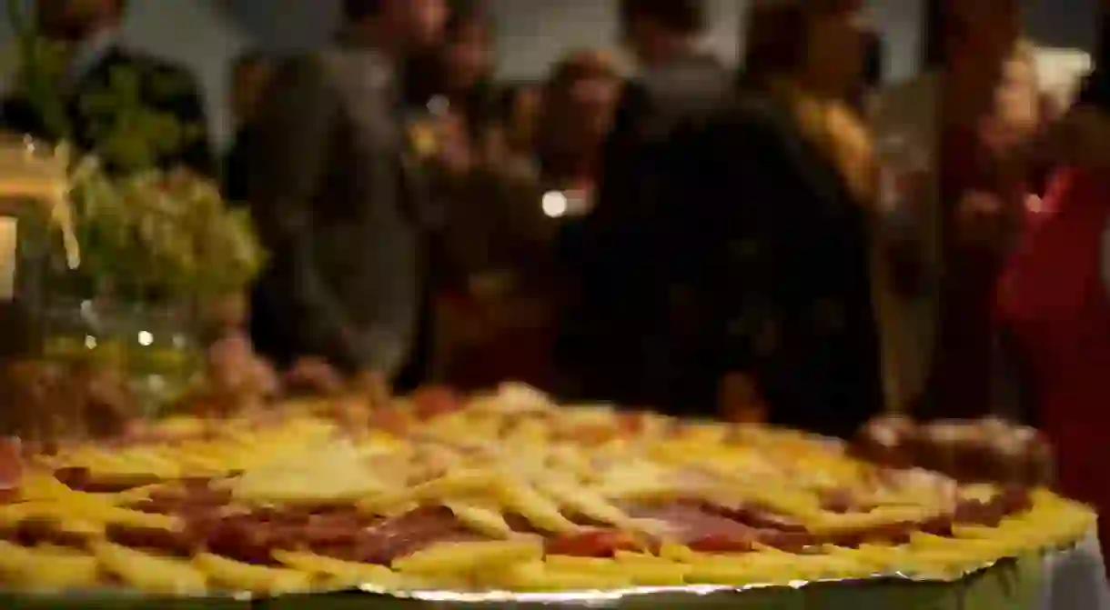 A picada spread being served at a group event in Buenos Aires