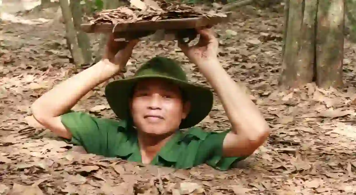 Crawling out of a tiny entrance at Cu Chi Tunnels