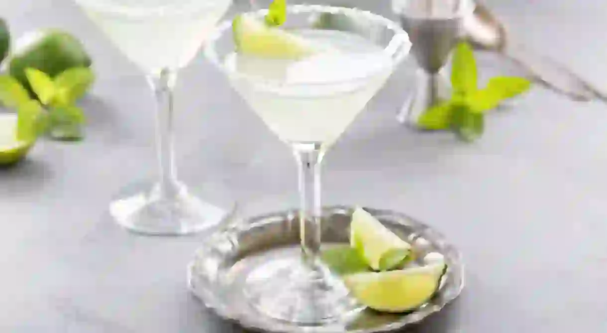 Lemonade martini cocktail garnished with lime and mint