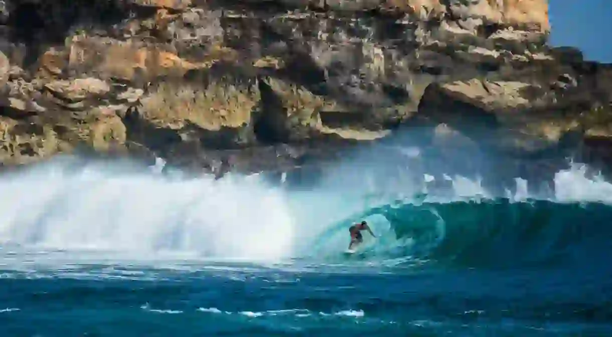 Leon Glatzer surfing off the coast of Java, Indonesia.