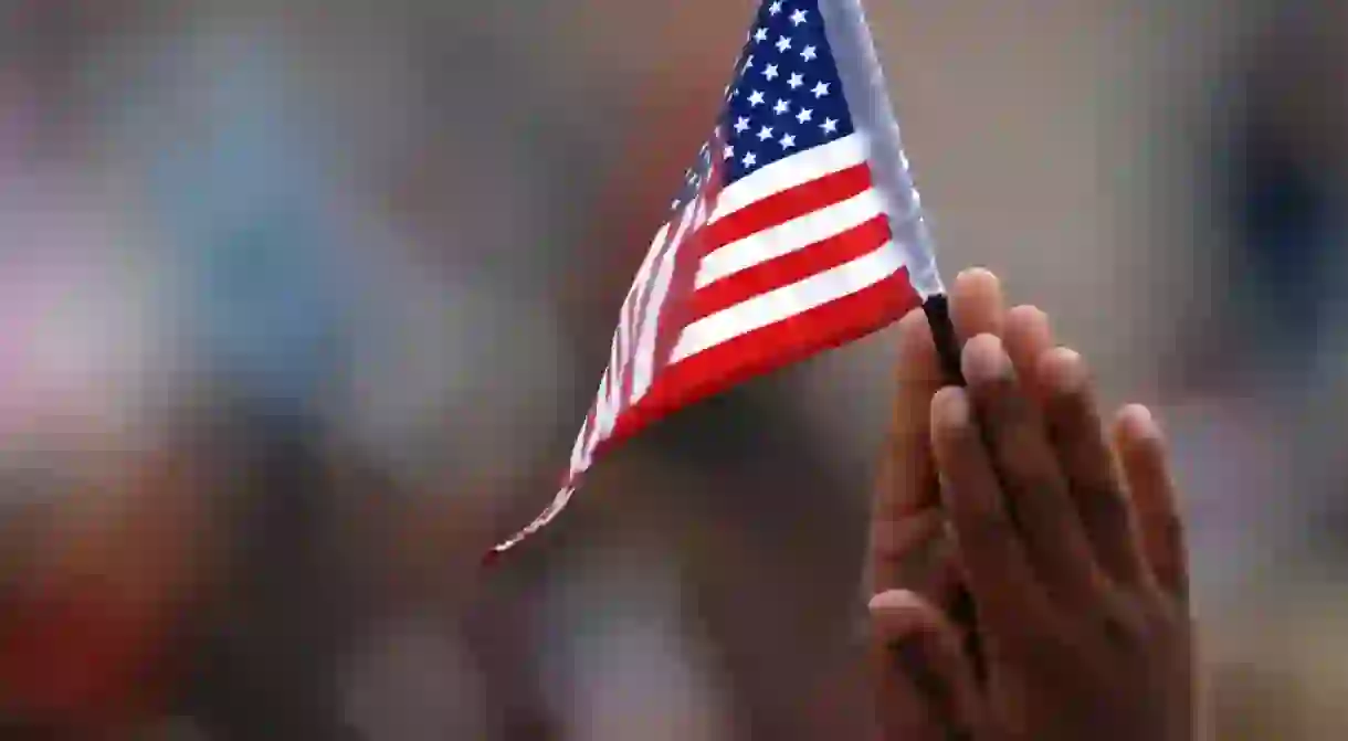 A student waves his flag during a 9/11 remembrance ceremony