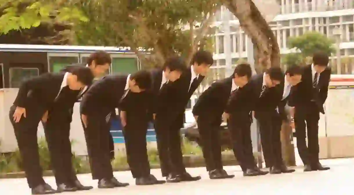 Group of young men bowing