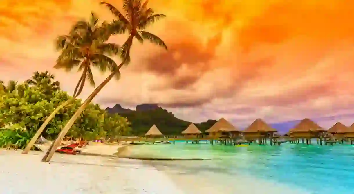 Bora Bora, French Polynesia. Otemanu mountain, beach and palm trees