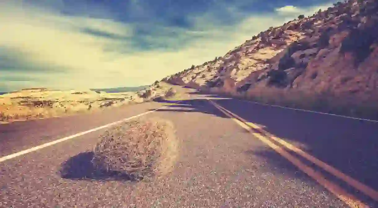 A tumbleweed rolls across the street