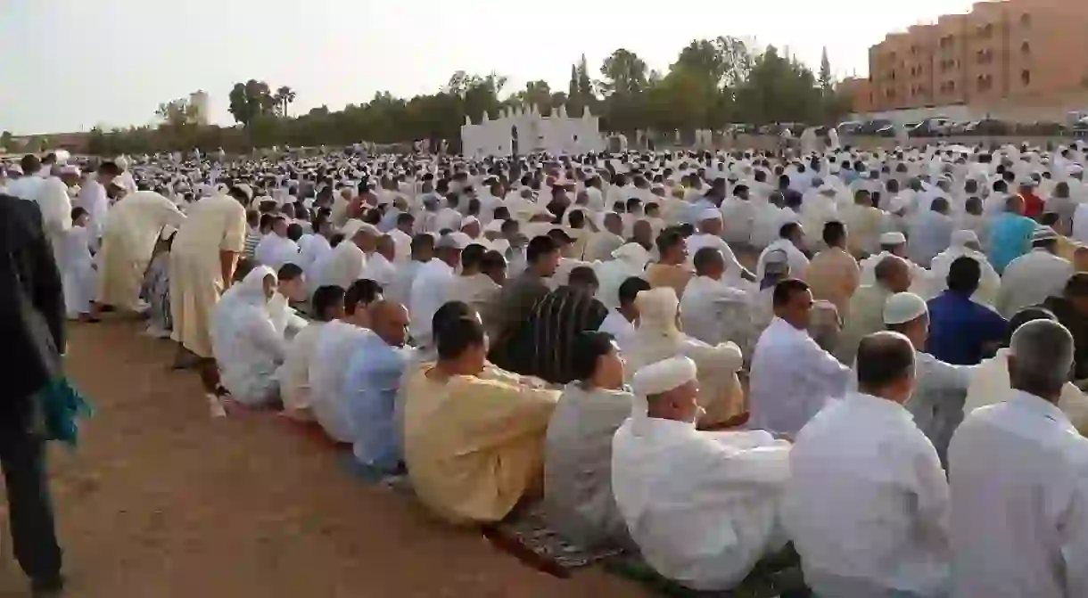 Moroccan men praying at the end of Ramadan