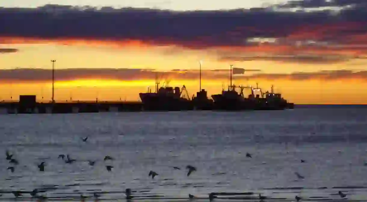 The sun sets over Puerto Madryn and its inhabitants