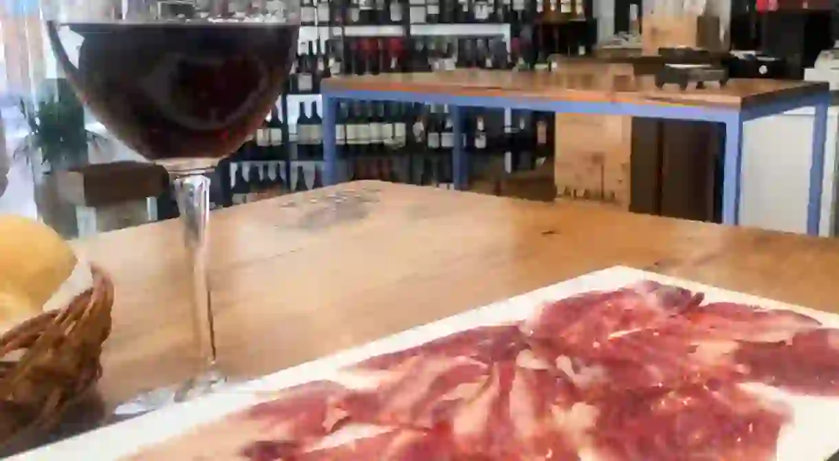 Try authentic local red wines and jamón on a Valencian food tour.