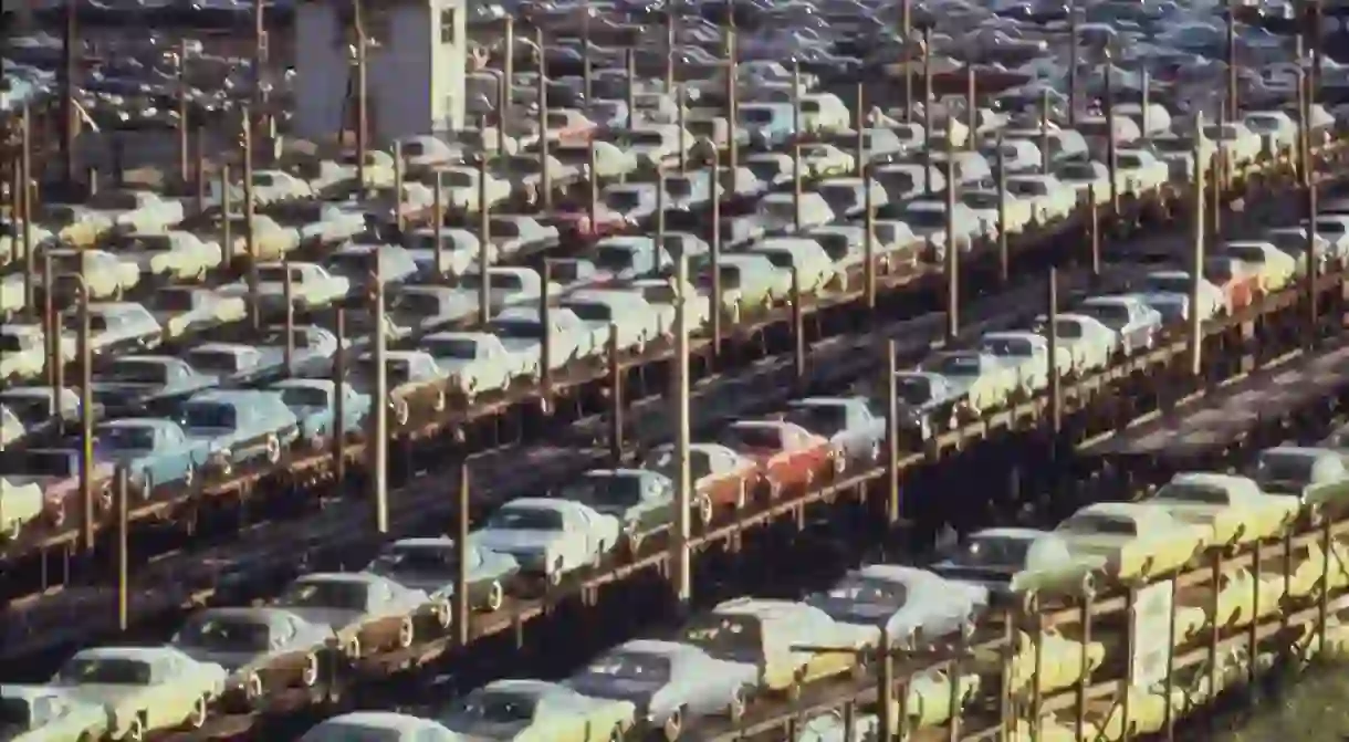 New cars built in Detroit loaded for rail transport, 1973