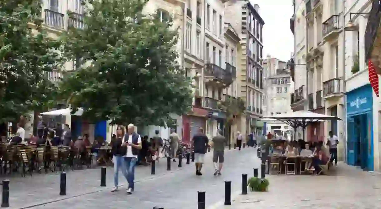 People strolling through the streets of Bordeaux/