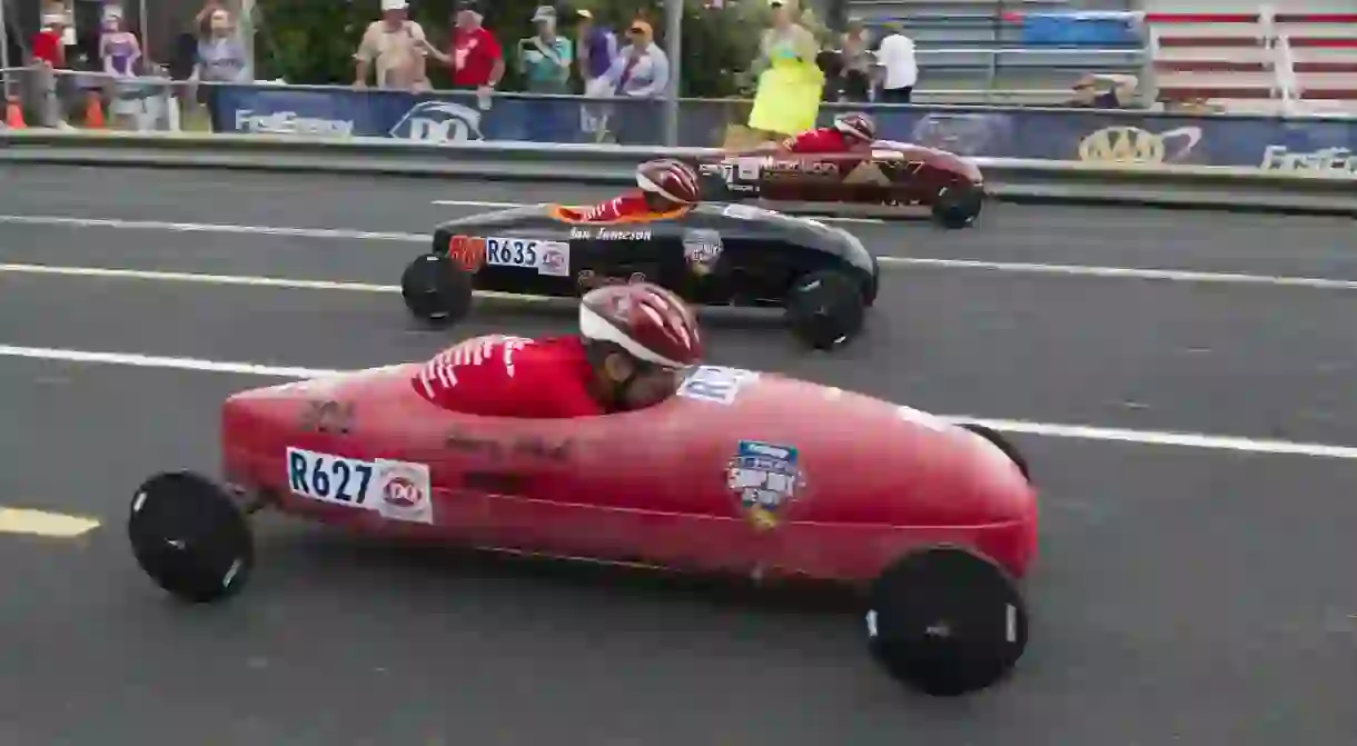 Racers speed downhill at the 2016 All-American Soap Box Derby