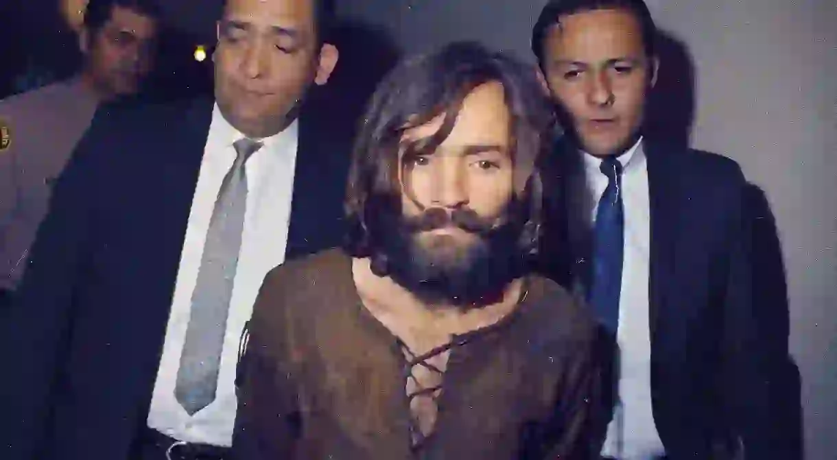 Police escorting Charles Manson