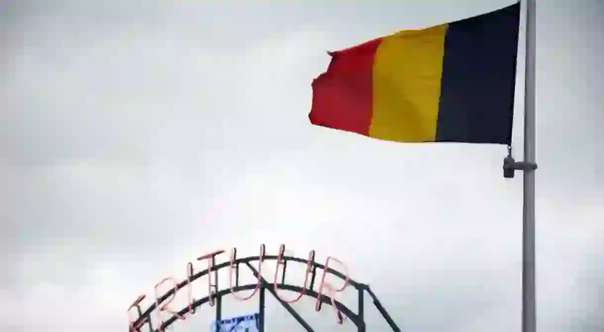 The Belgian flag and a frituur or friterie, two important national symbols