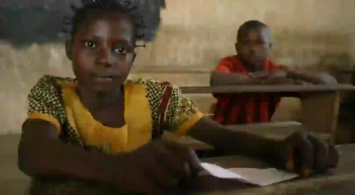 Young girl and boy attending school