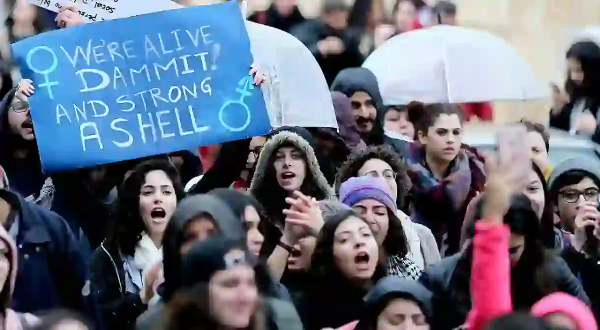 Activists participate in a match calling for granting women more rights across the streets of Beirut, Lebanon