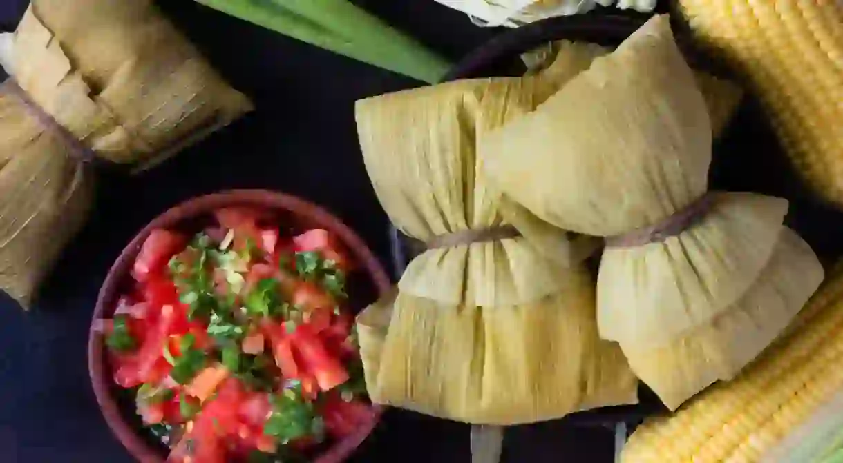 Homemade humitas served with salsa