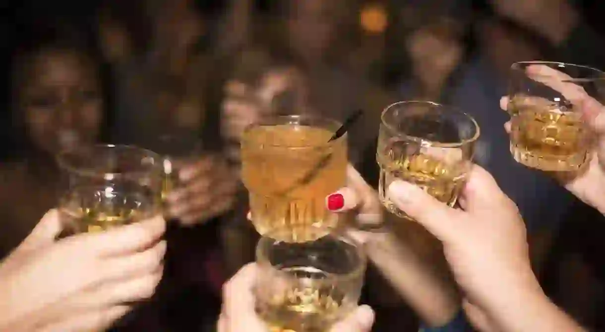 Friends toasting at the bar