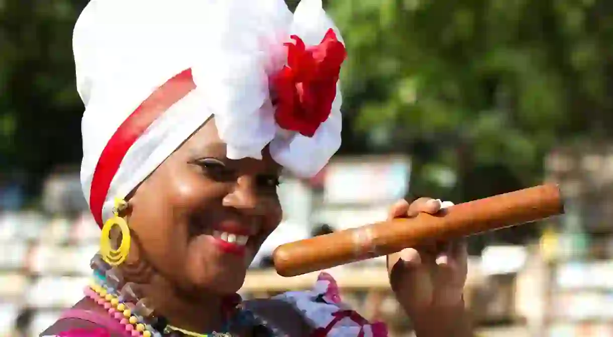 Cuban woman poses with cigar