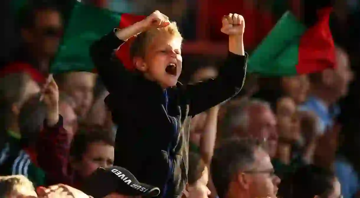 Young fan cheering on County Mayo