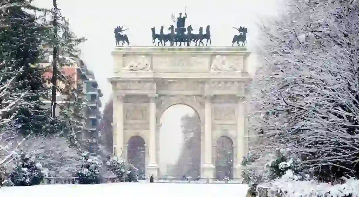 Peace Arch covered with snow in Milan, Italy