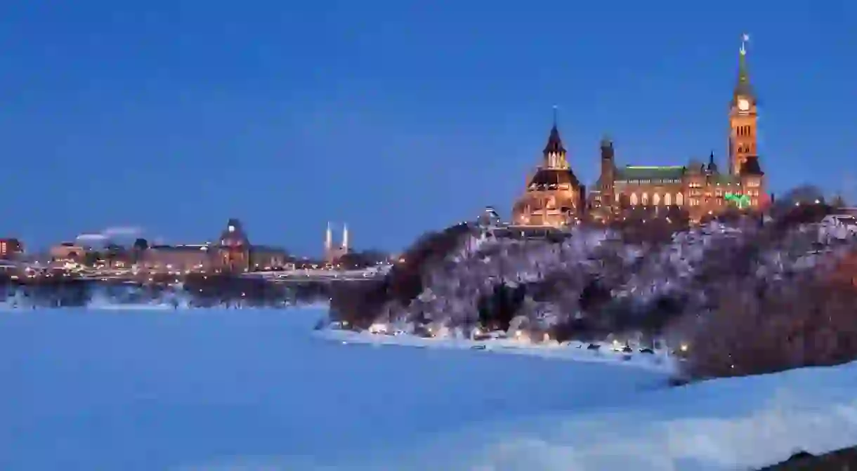 Ottawas Parliament Buildings glowing in winter