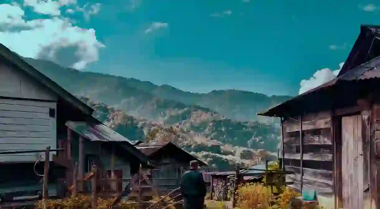 A man who was heading towards his farm captured in between beautiful landscape in Nagaland, Northeast India