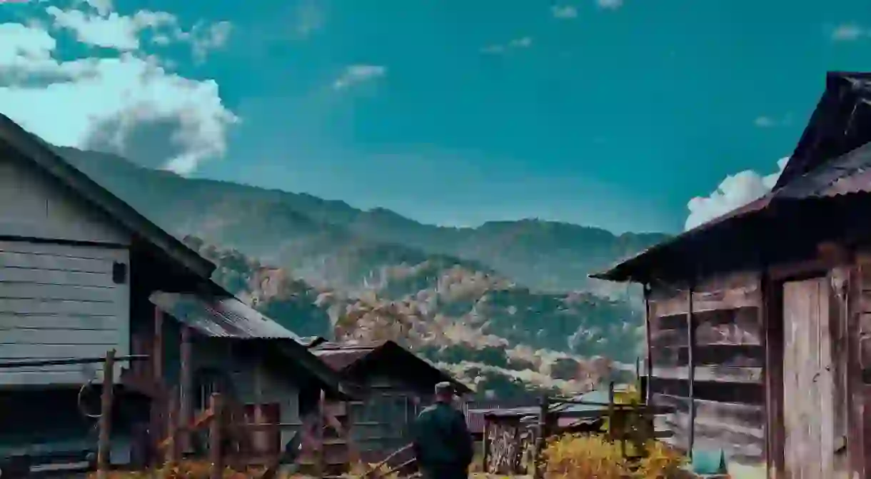 A man who was heading towards his farm captured in between beautiful landscape in Nagaland, Northeast India