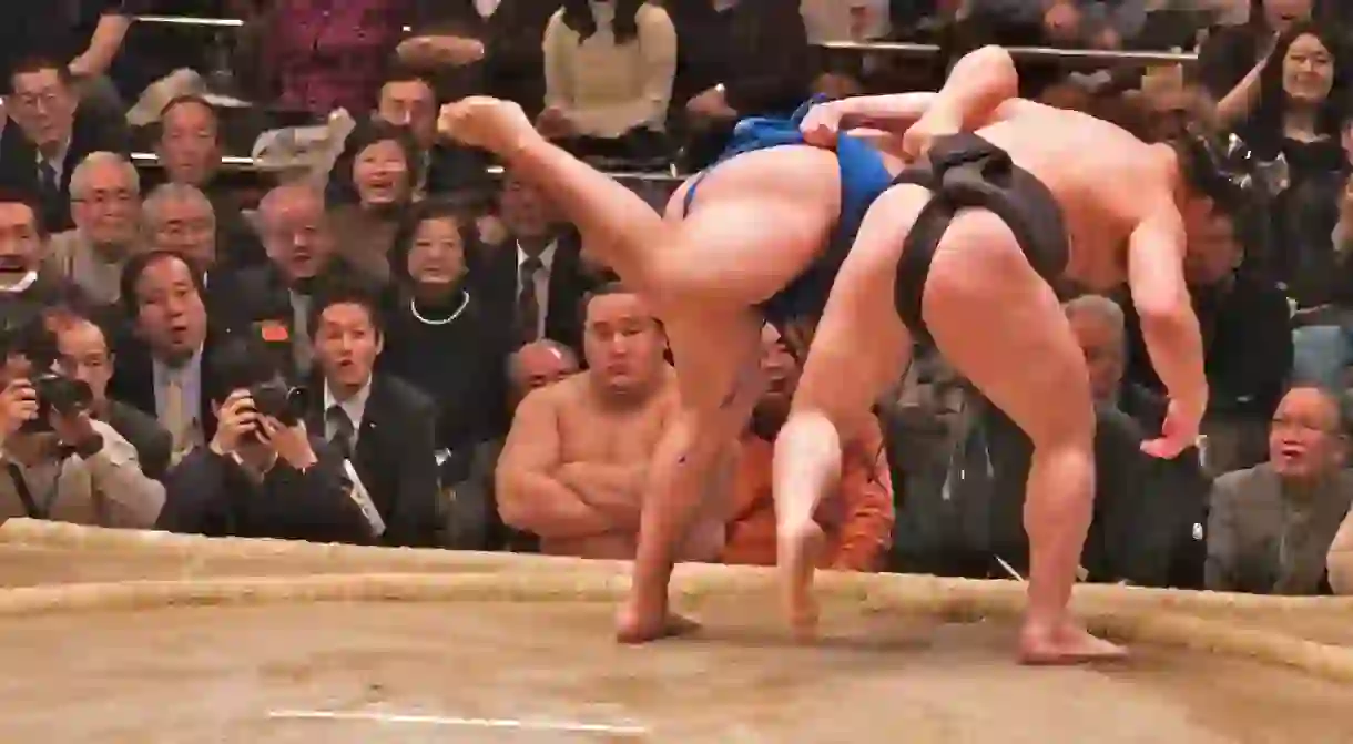 Two rikishi (wrestlers) competing in a bout