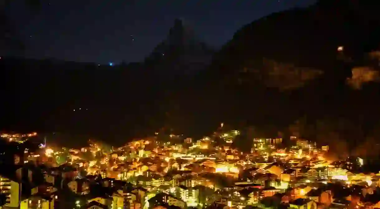 Switzerlands famous ski resort shimmers by night