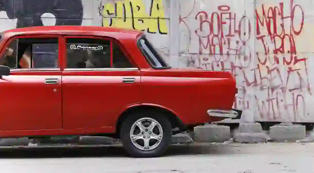 Graffiti and old cars in Cuba