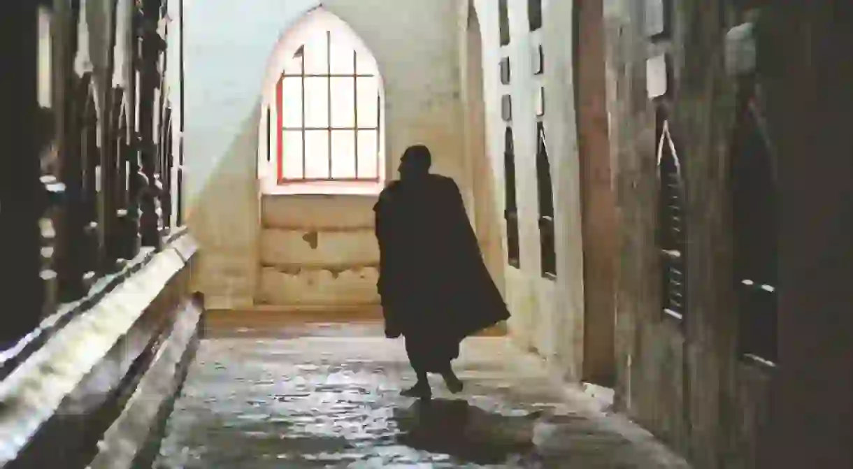 The silhouette of a monk inside a temple in Bagan, Myanmar /