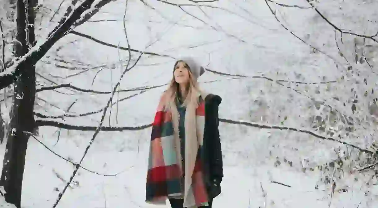 Woman watching the snow fall