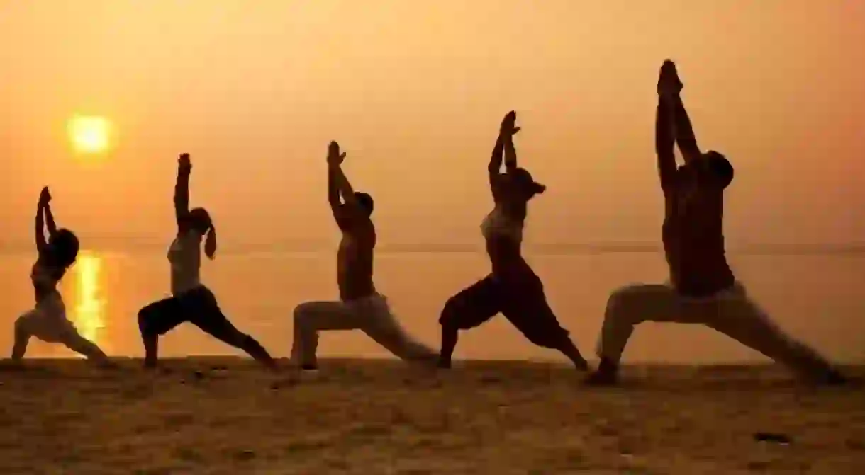 Beach yoga at sunset