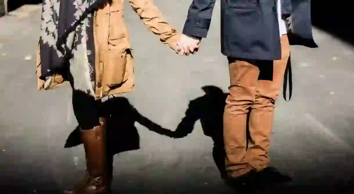 Couple holding hands