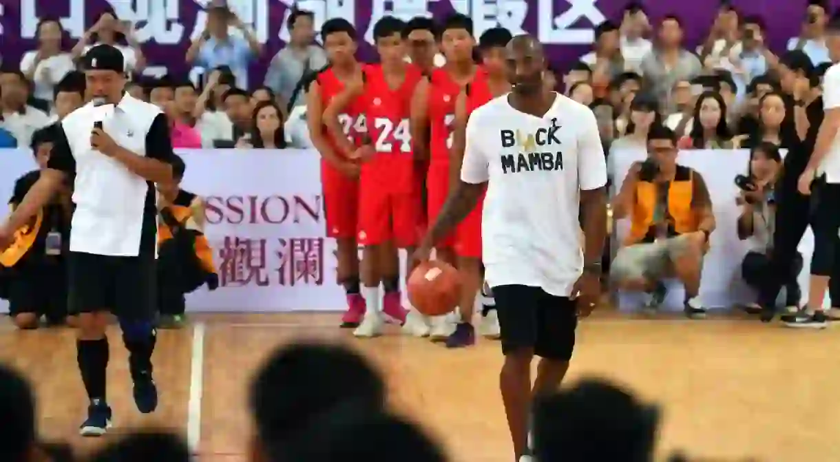 Former NBA player Kobe Bryant teaching basketball in Chinas Hainan Province