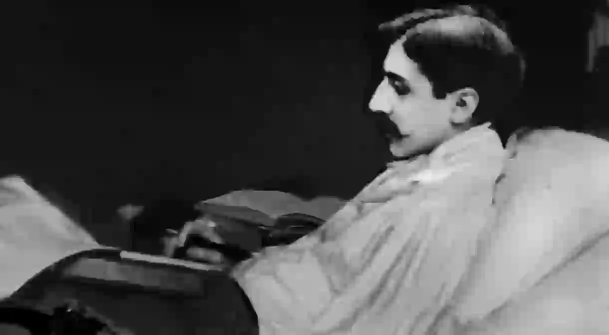 Marcel Proust working in bed, early 20th-century. Photographer unknown.