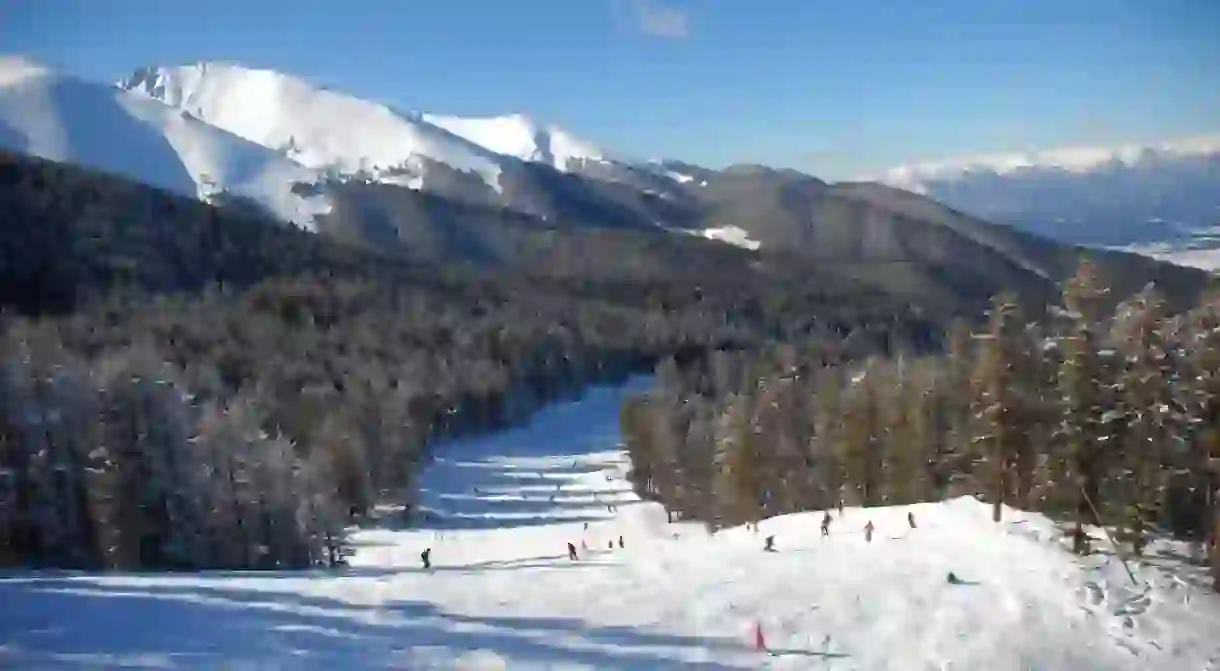 Panorama of winter mountains. Alpine ski resort Bansko, Bulgaria