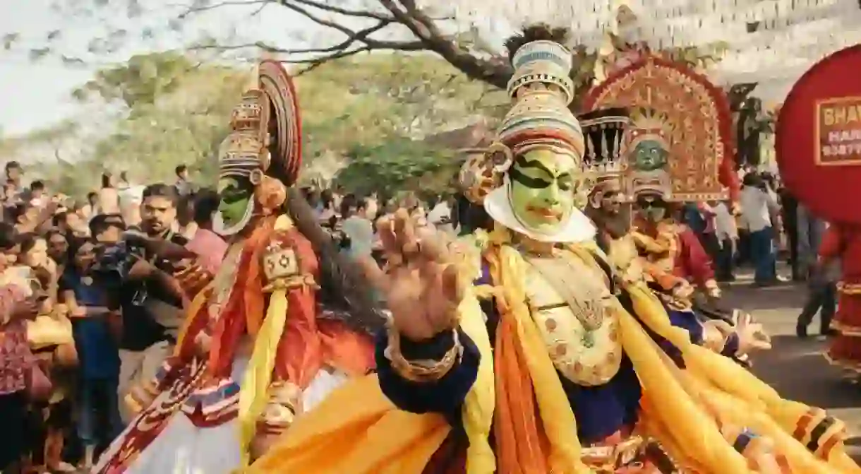 Kathakali dancers perform at a street carnival during Kochi new year celebration