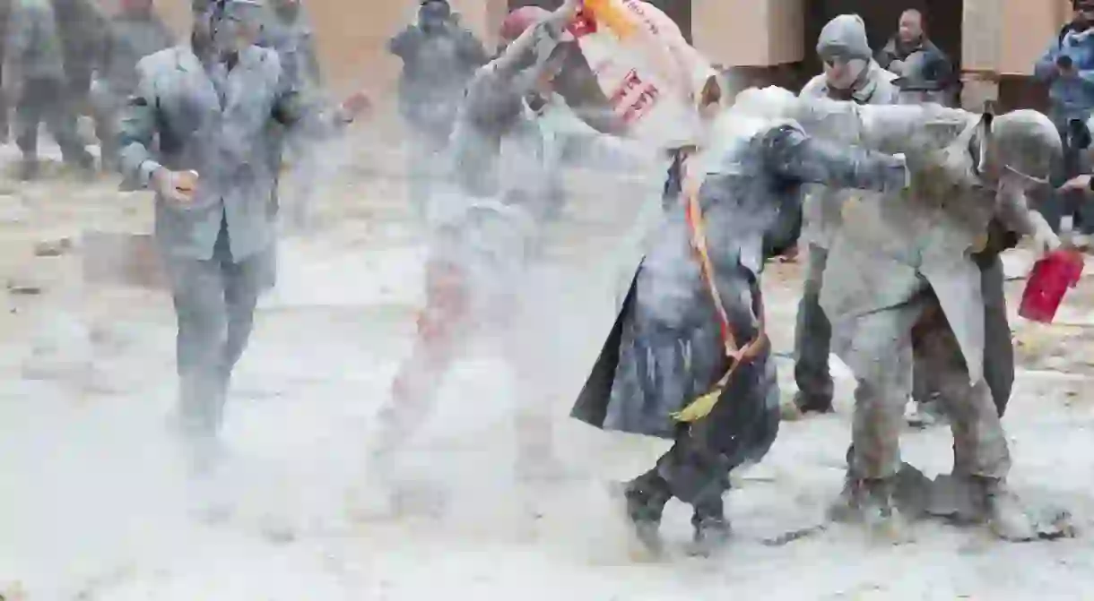 Locals take part in the annual flour fight in Ibi, Spain