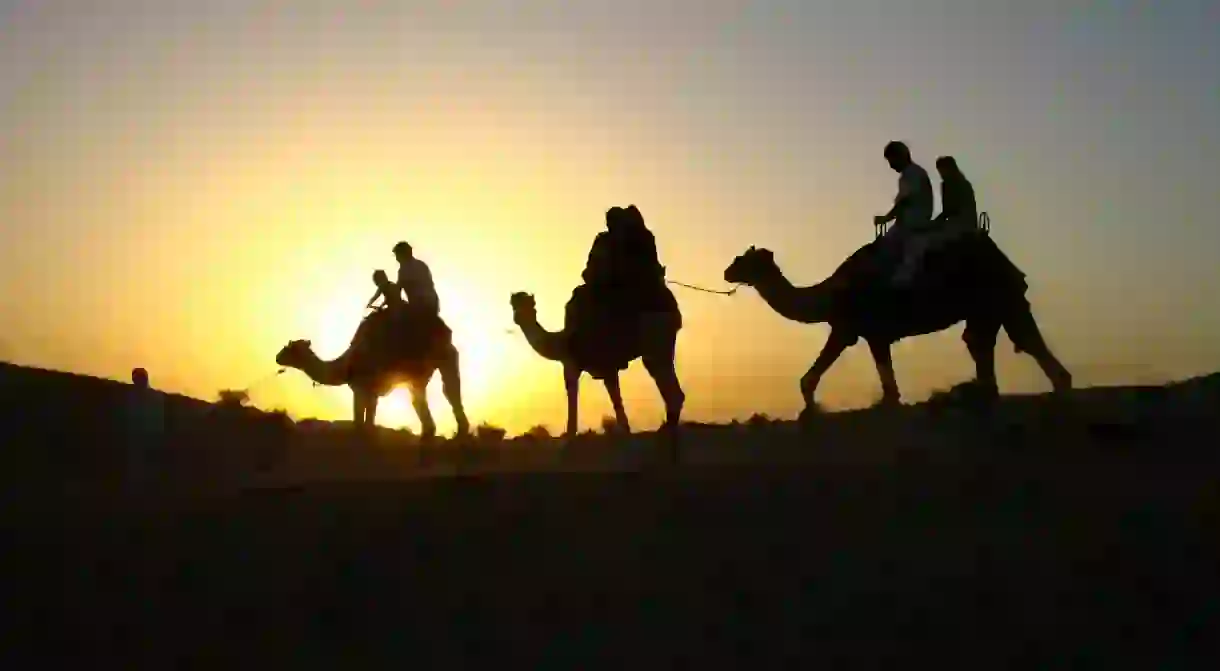 Riding a camel in the desert is a must