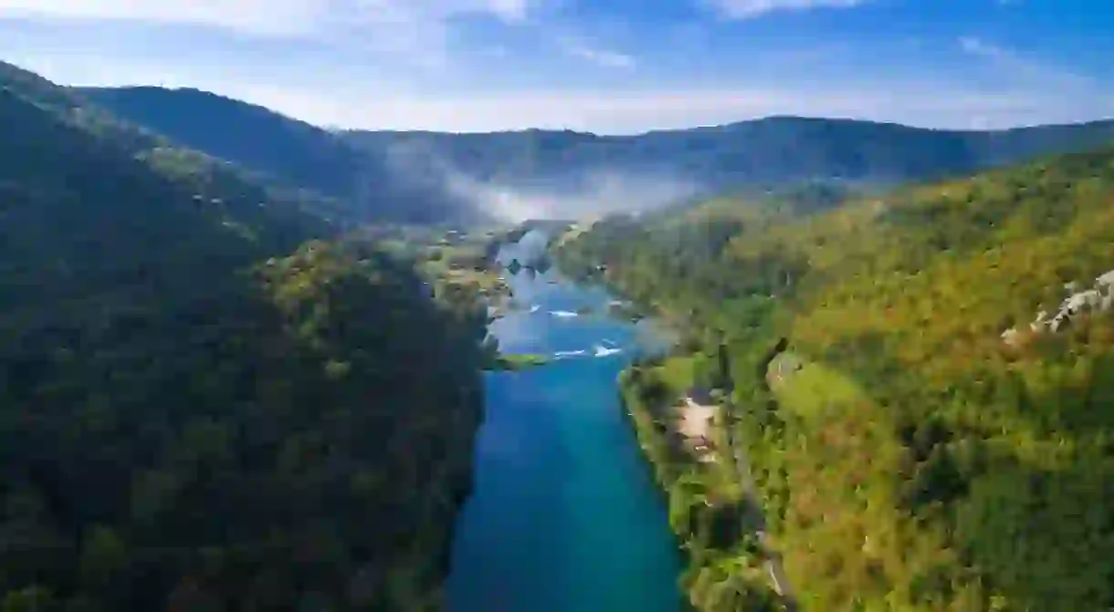 Aerial view of Una river surrounded by forest and hills, Bosnia and Herzegovina