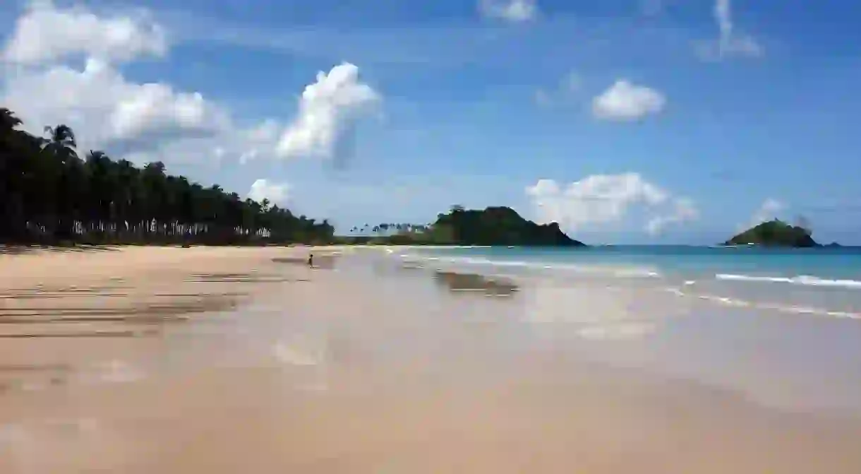 Child running to sea in El Nido, Palawan