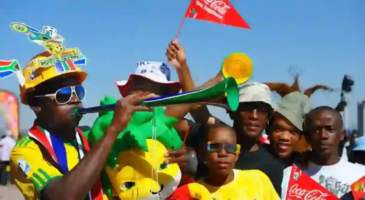 Soccer fan blows a Vuvuzela