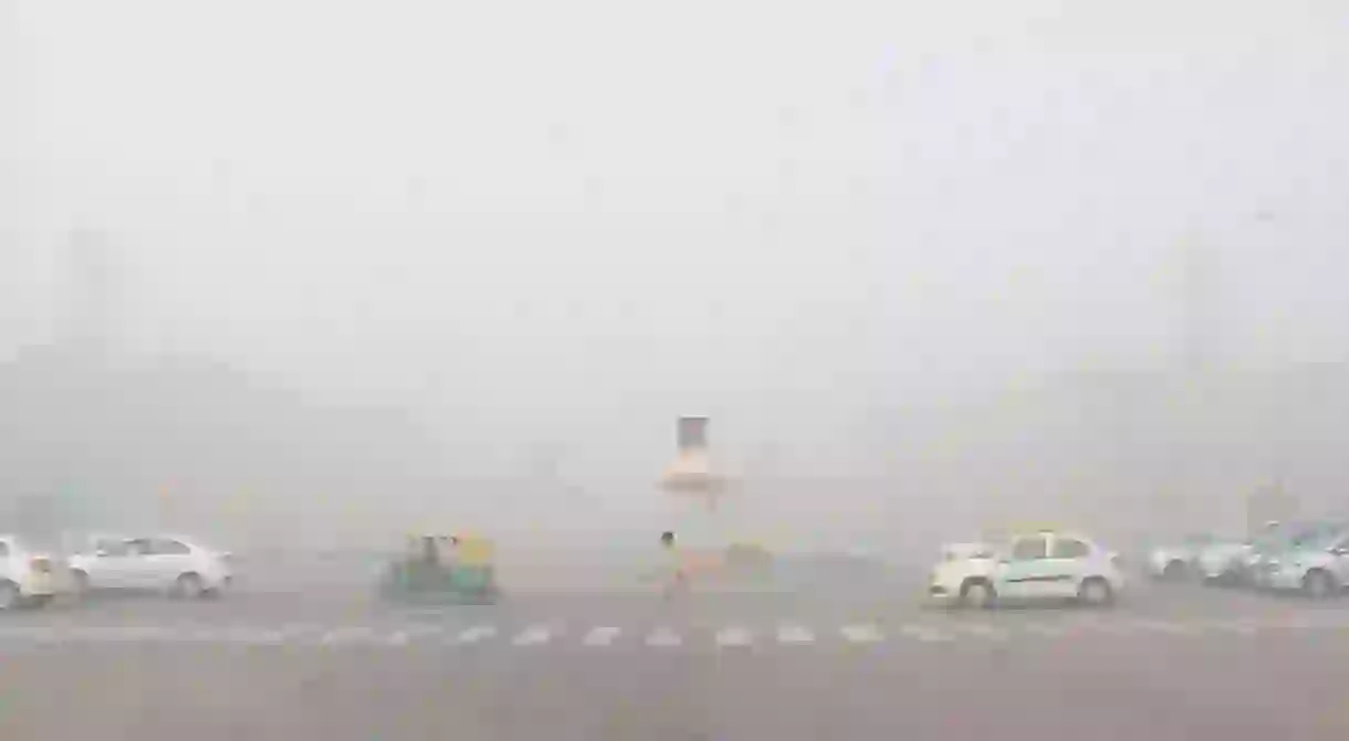 A view of Rajpath Avenue in Delhi where heavy smog and low visibility have made travel hazardous